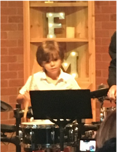 Boy having fun playing the Drums